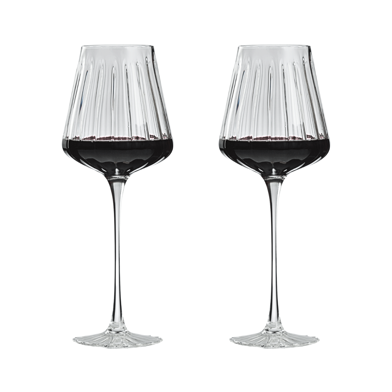 Two wine glasses filled with red wine on a white background